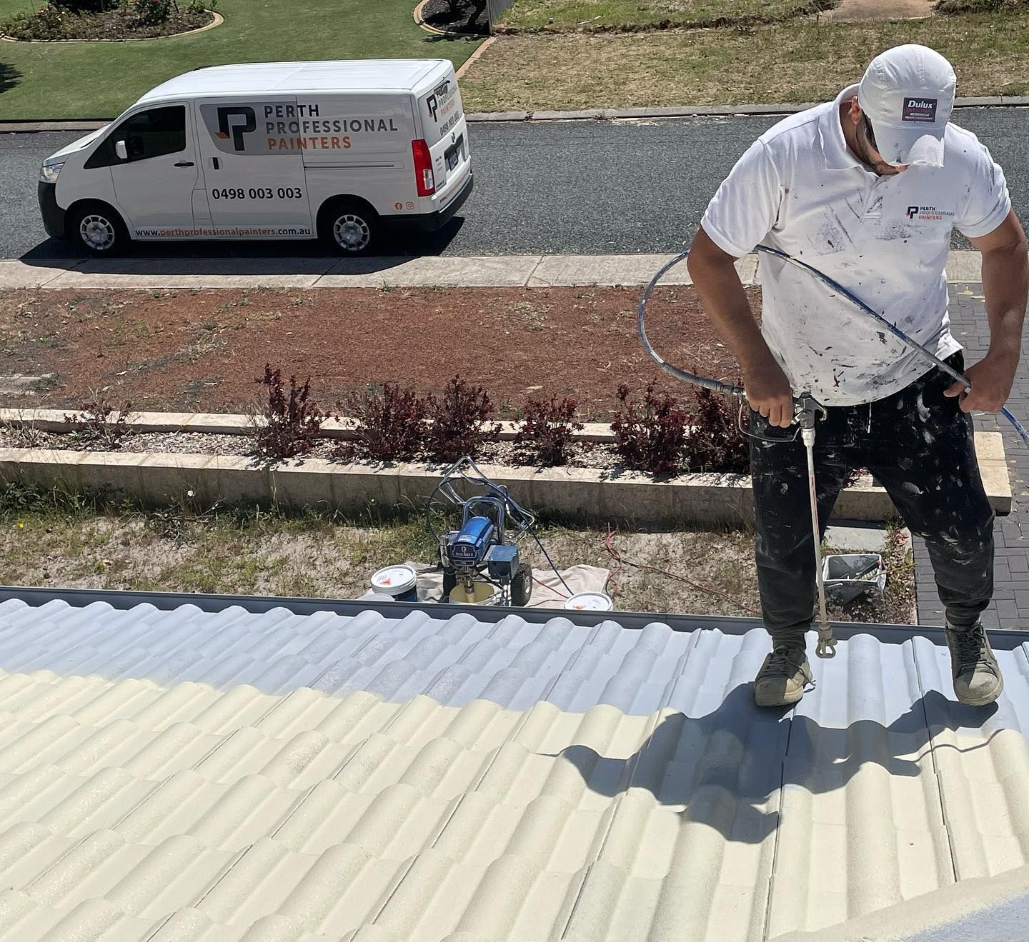 Painter painting roof
