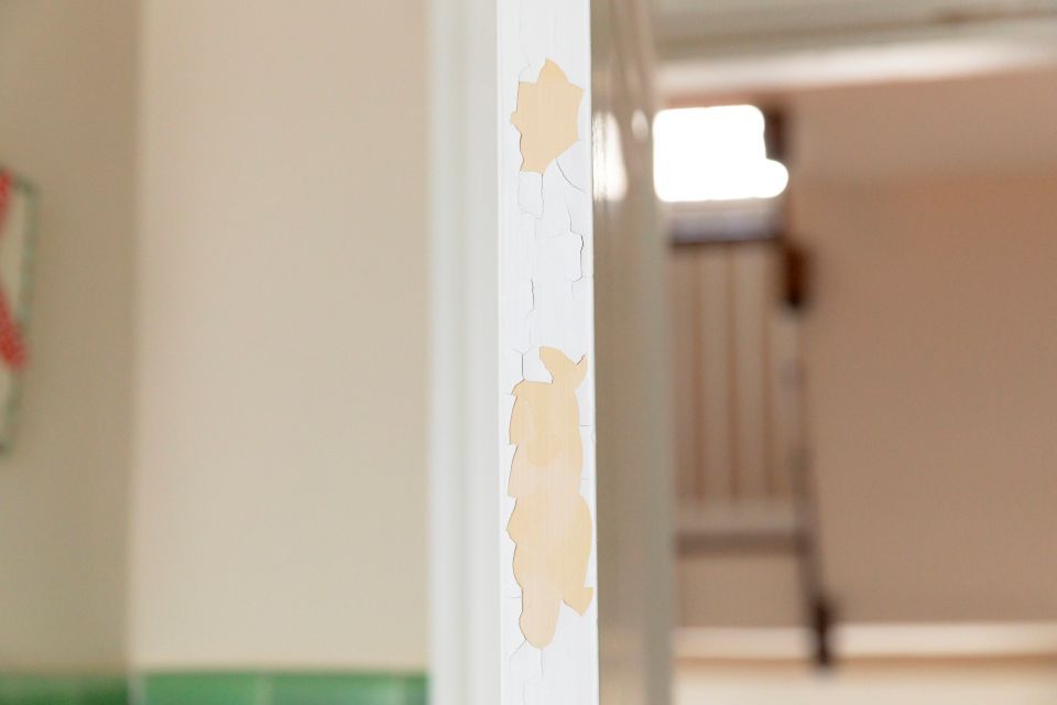 peeling paint off wall and skirting