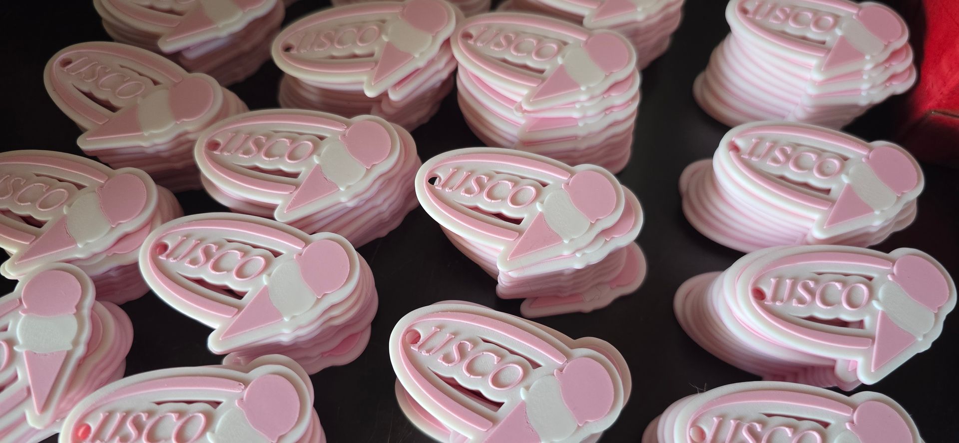 Stacks of pink and white ice cream-shaped objects with the word 