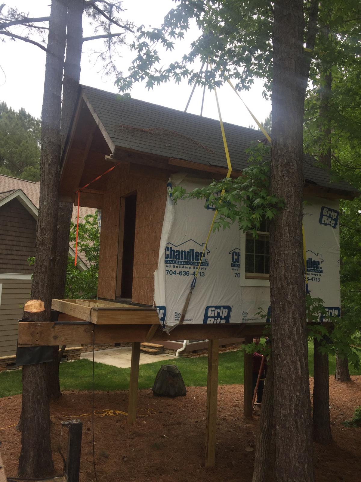 Treehouse maneuvered in between 4 trees by crane service in Statesville, NC