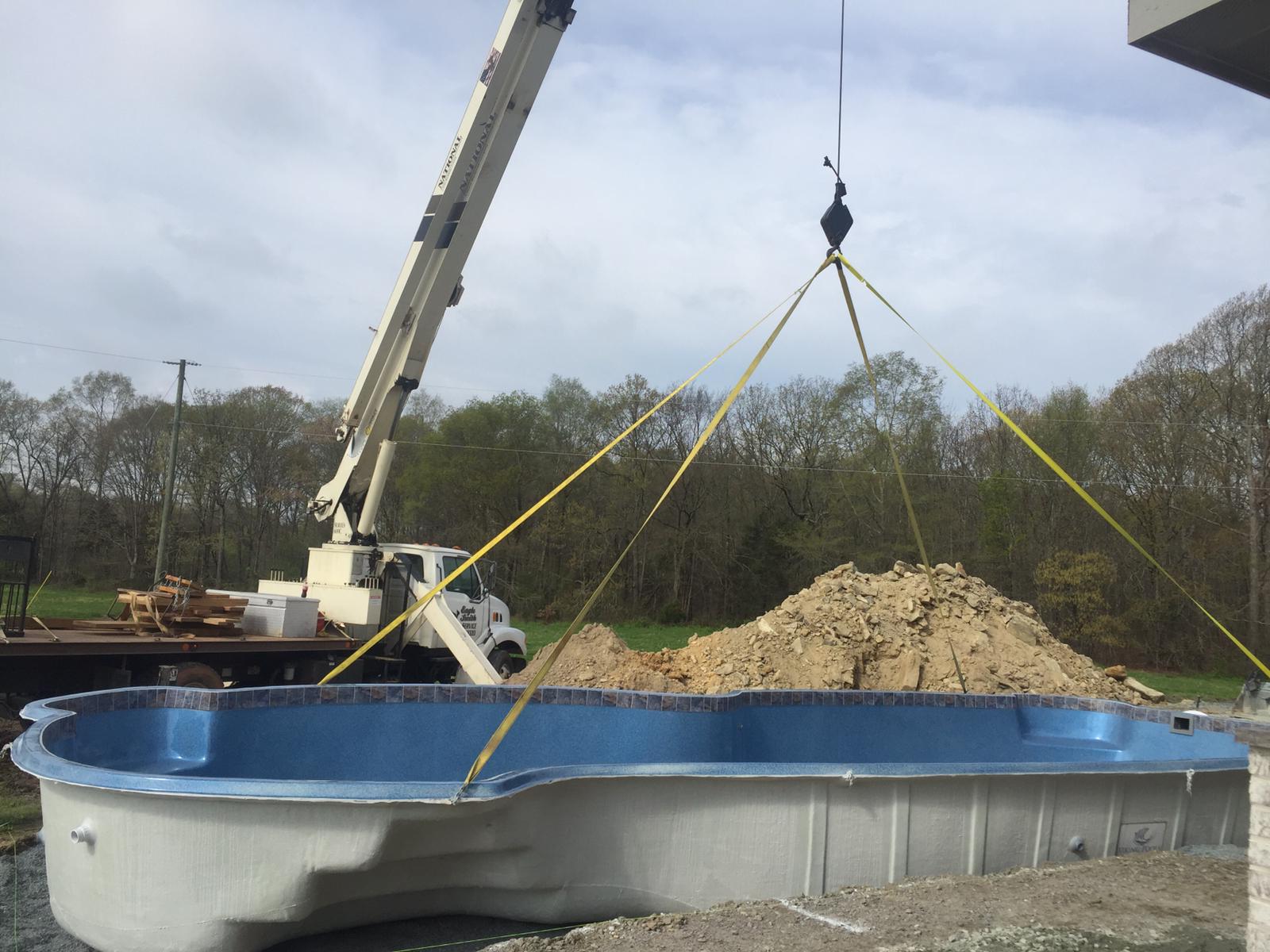 Large pool connected with straps to a crane in Statesville, NC