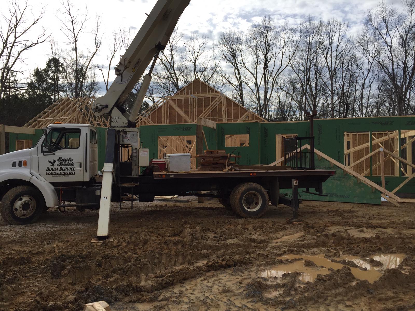Crane service truck in front of home construction in Salisbury, NC