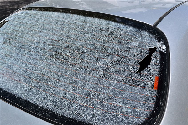 A car with a broken rear view mirror on it
