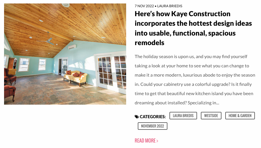 Interior shot of a remodeled room with light wood ceiling, blue walls, and french doors.