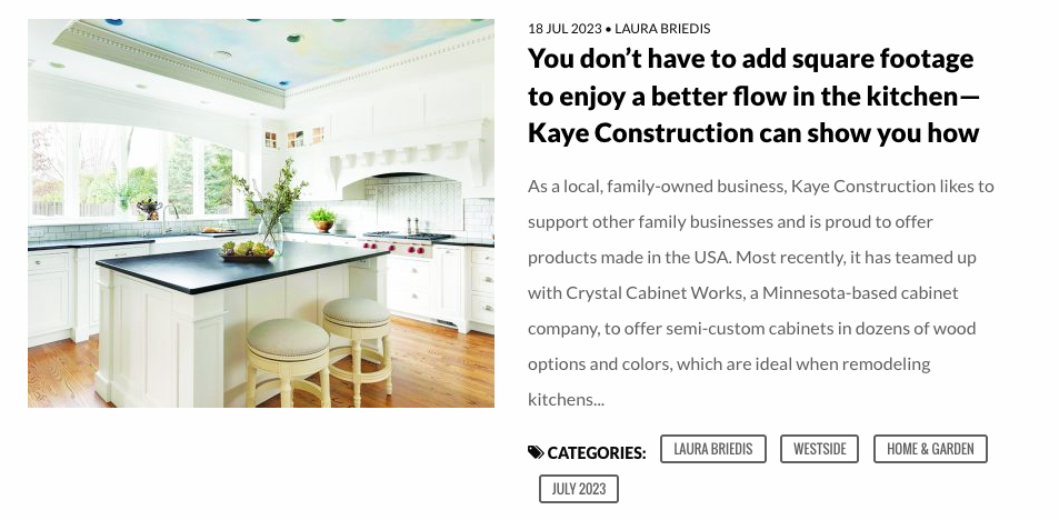 Kitchen with white cabinets, island with stools. Text: 