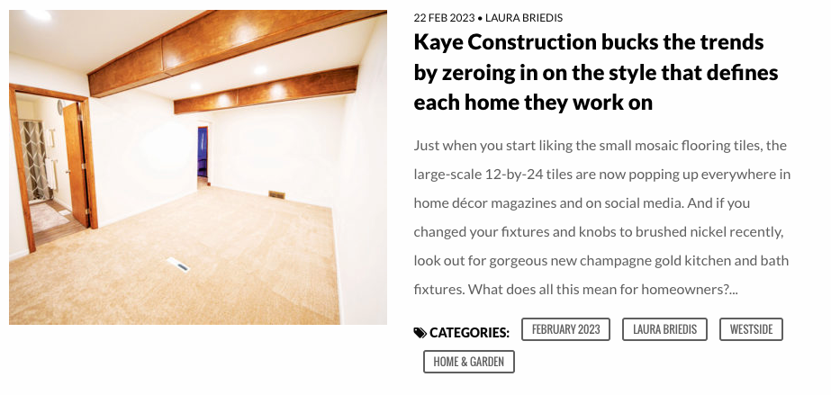 Interior of a room with exposed wooden beams on the ceiling and white walls.