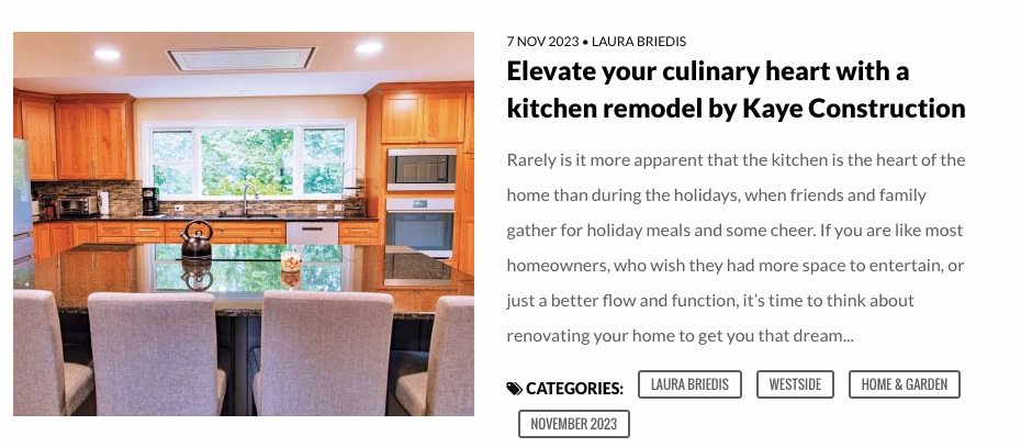 Kitchen remodel by Kaye Construction, with wooden cabinets, granite countertop, and modern appliances.