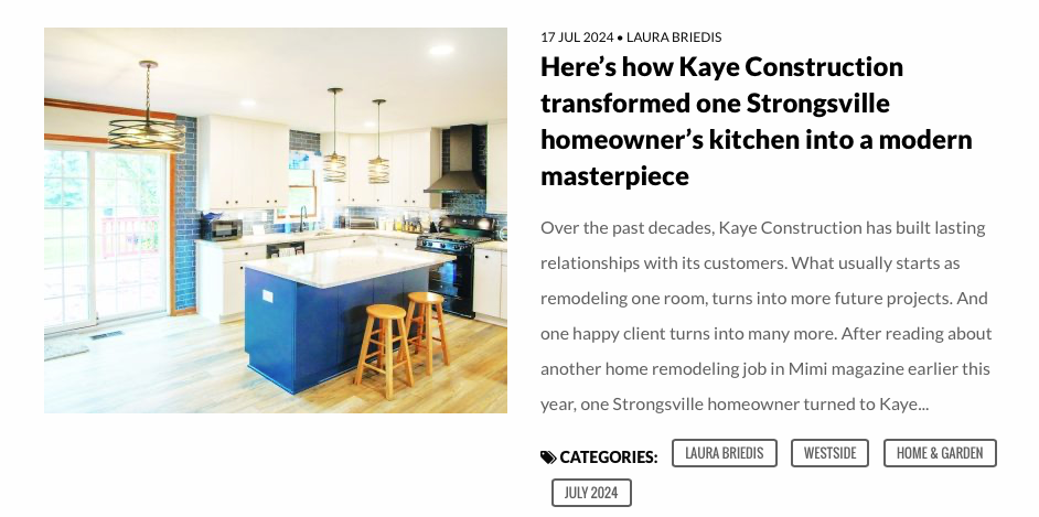 A modern kitchen remodel by Kaye Construction, featuring a blue island and light wooden stools.