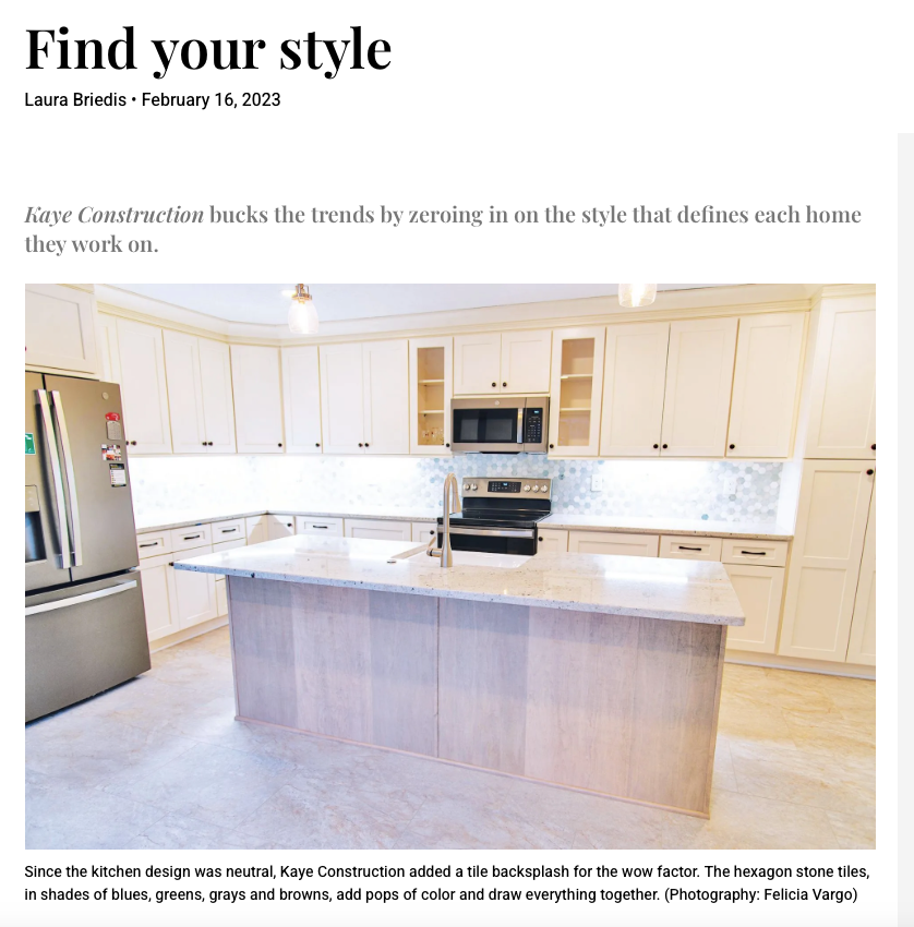 A modern kitchen with light-colored cabinets and a central island.
