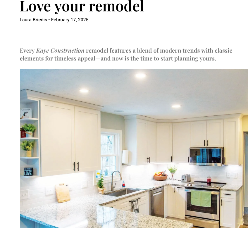 Modern white kitchen remodel with granite countertops and stainless steel appliances.