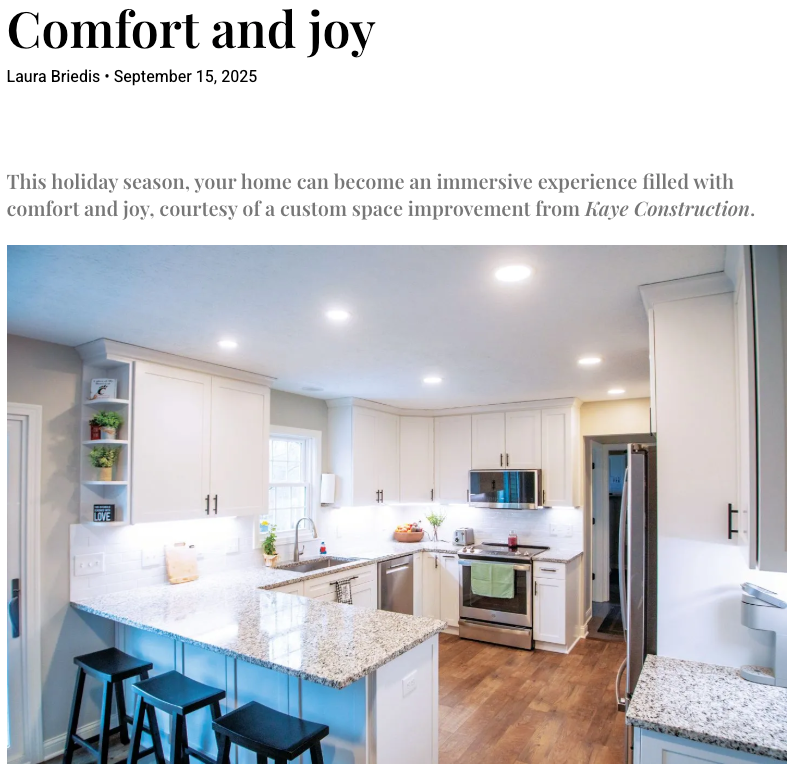 A modern kitchen with white cabinets, a granite countertop, and stainless steel appliances.