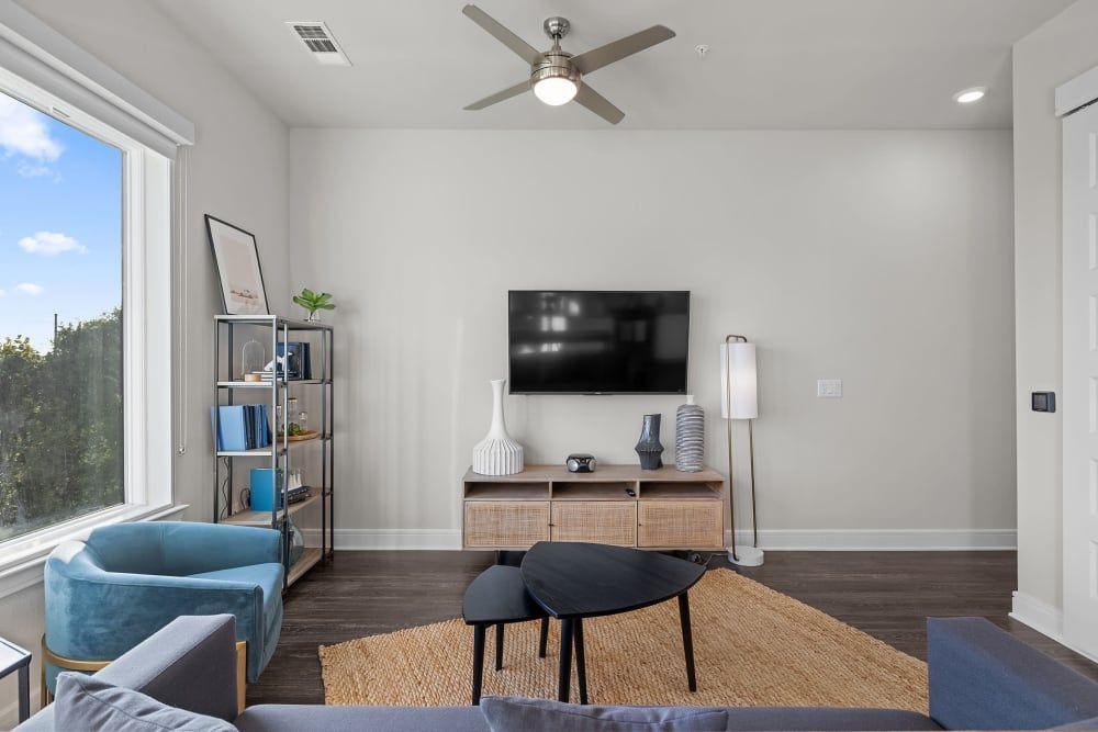Spacious Living Room with Ceiling Fan at The Clark