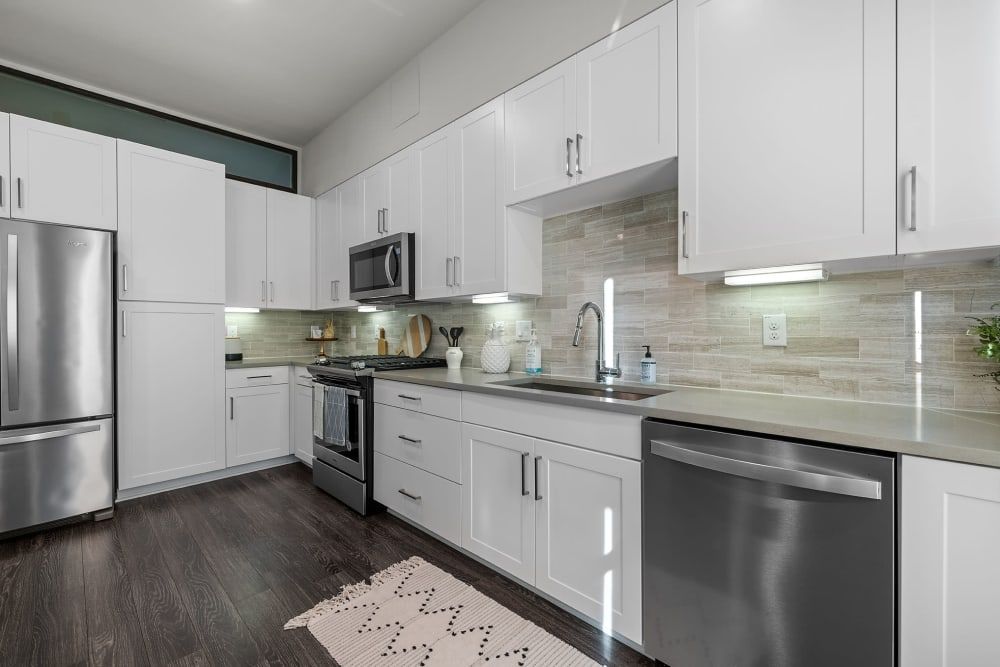 Modern Kitchen with White Cabinets at The Clark