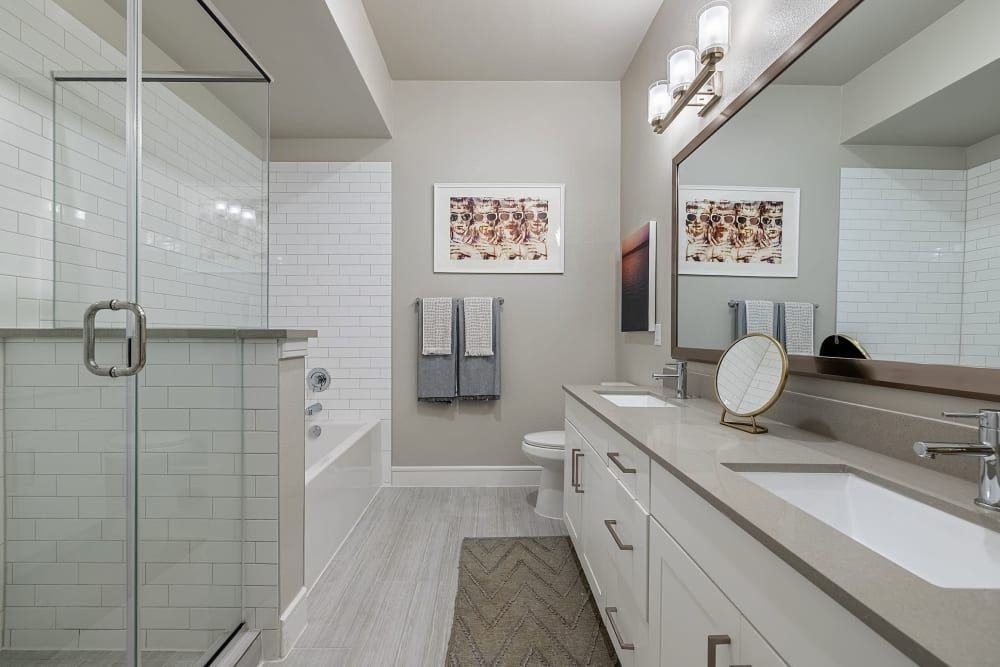 Modern Bathroom with Bathtub and Shower at The Clark