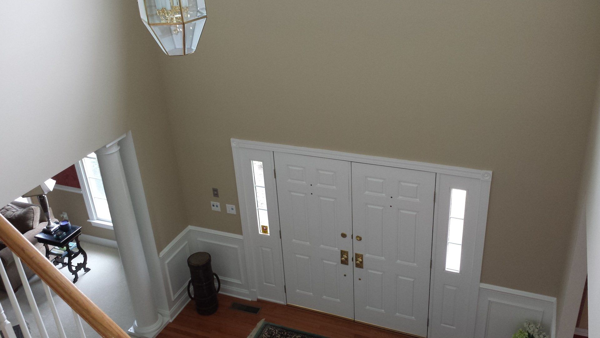 a view of a hallway from the second floor of a house.