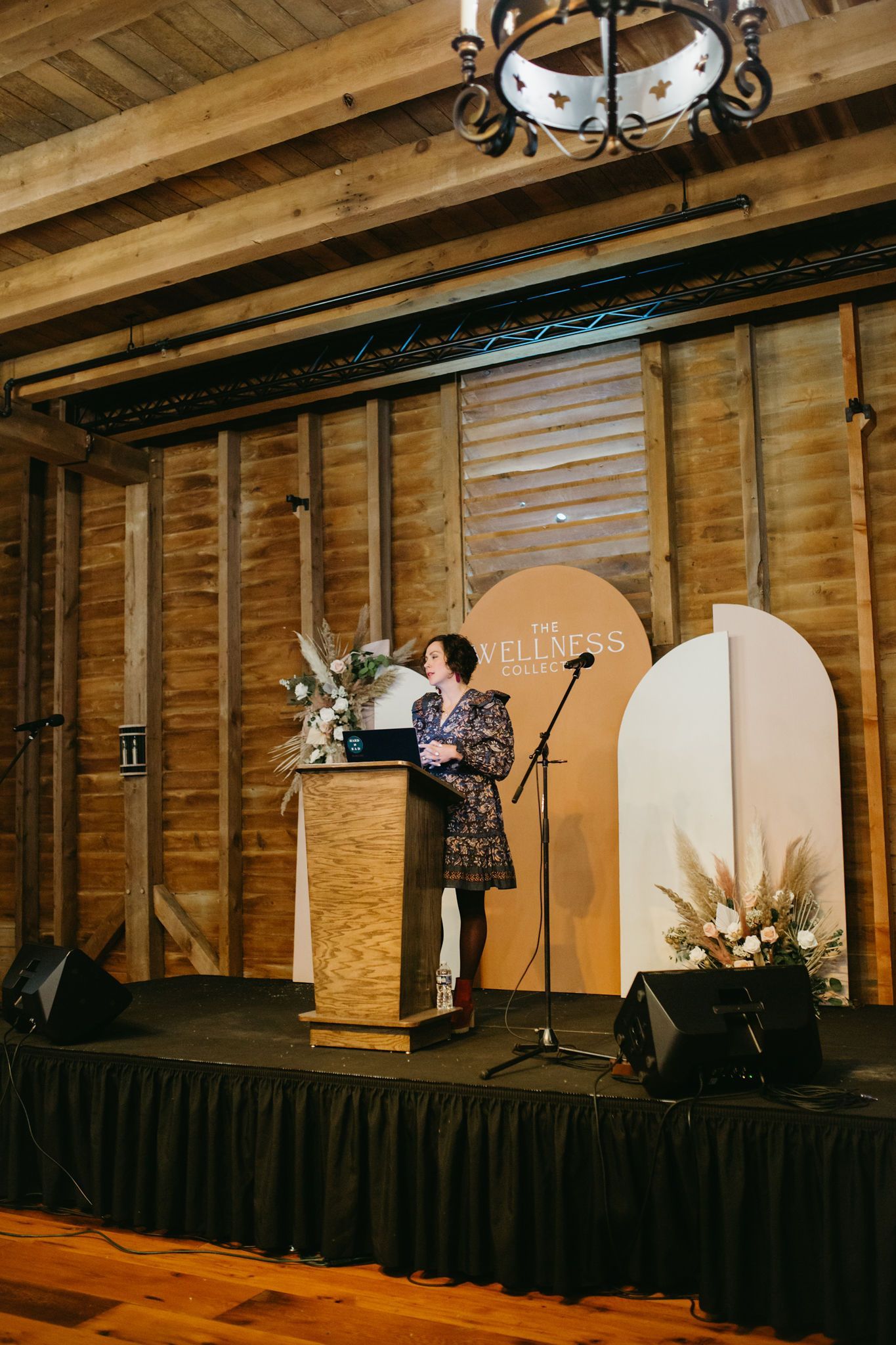 A woman is standing at a podium giving a speech.