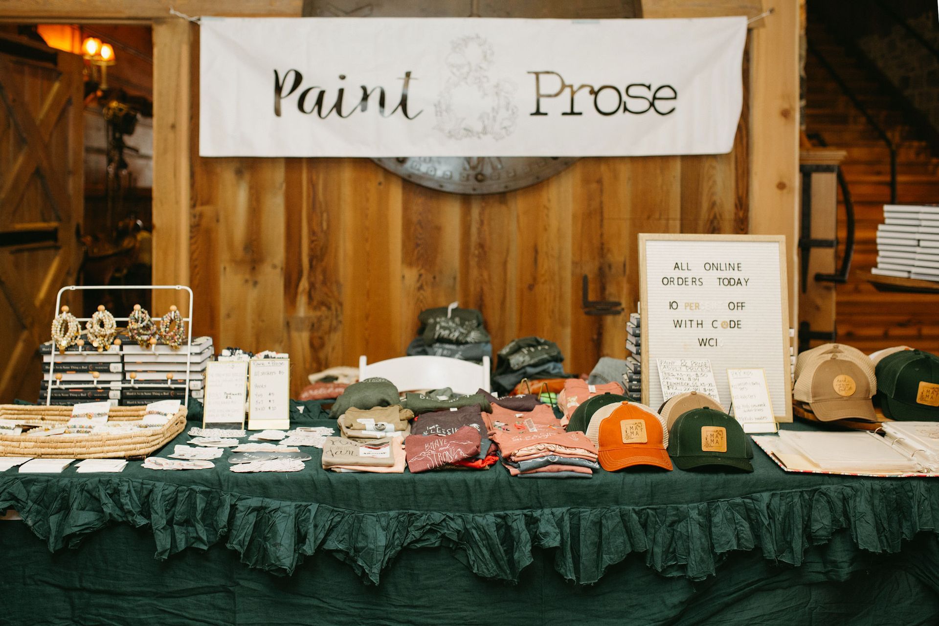 A table with a sign that says paint prose on it