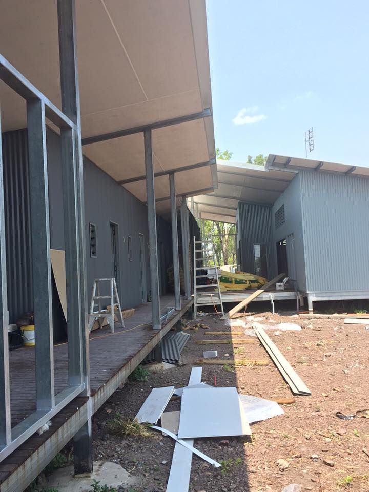 A Building Under Construction With A Lot Of Pieces Of Wood On The Ground — SLS Builders Pty Ltd in Humpty Doo, NT