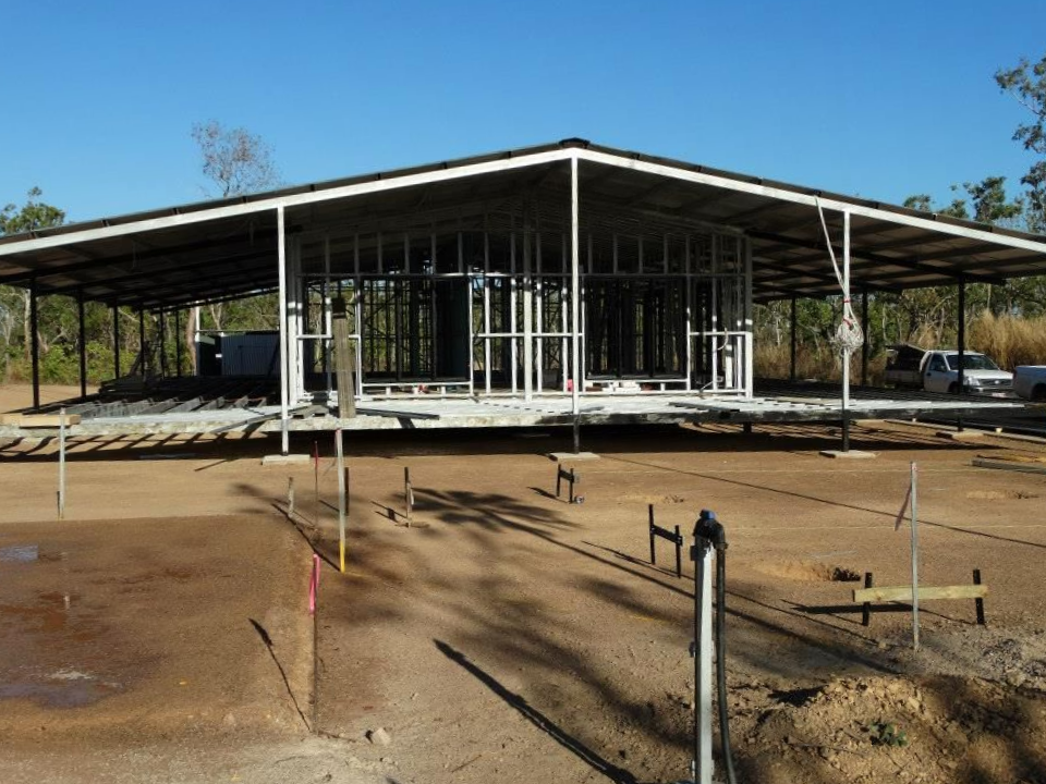 A Large Metal Structure Is Being Built In The Middle Of A Dirt Field — SLS Builders Pty Ltd in Alice Springs, NT