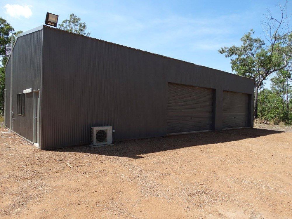 A Large Building With A Lot Of Garage Doors in Humpty Doo, NSW