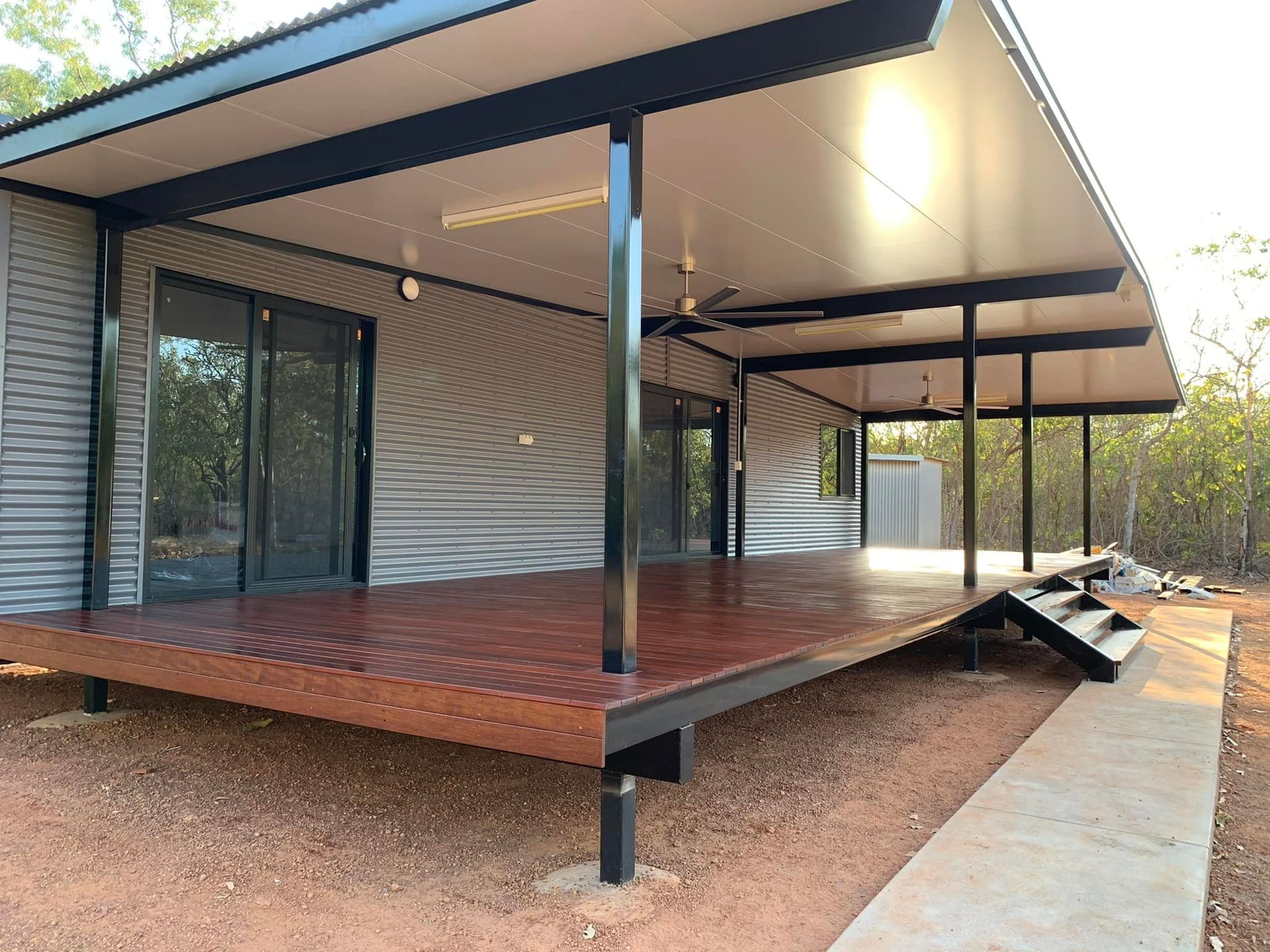 A Newly Constructed House With Wooden Patio