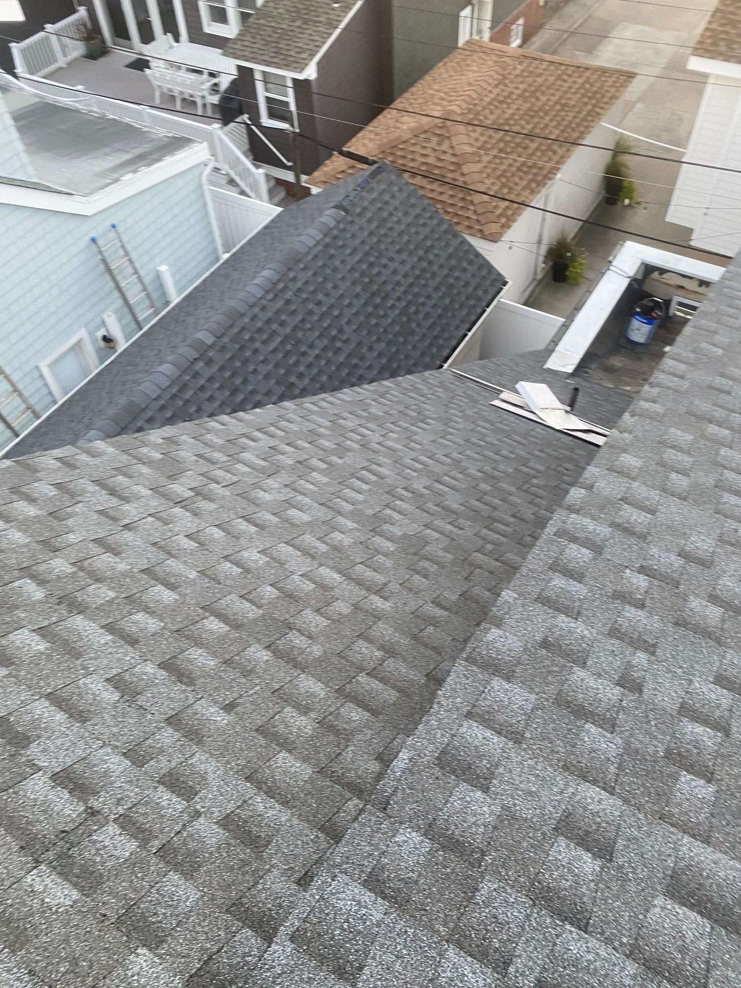 A view of a roof from the top of a building.