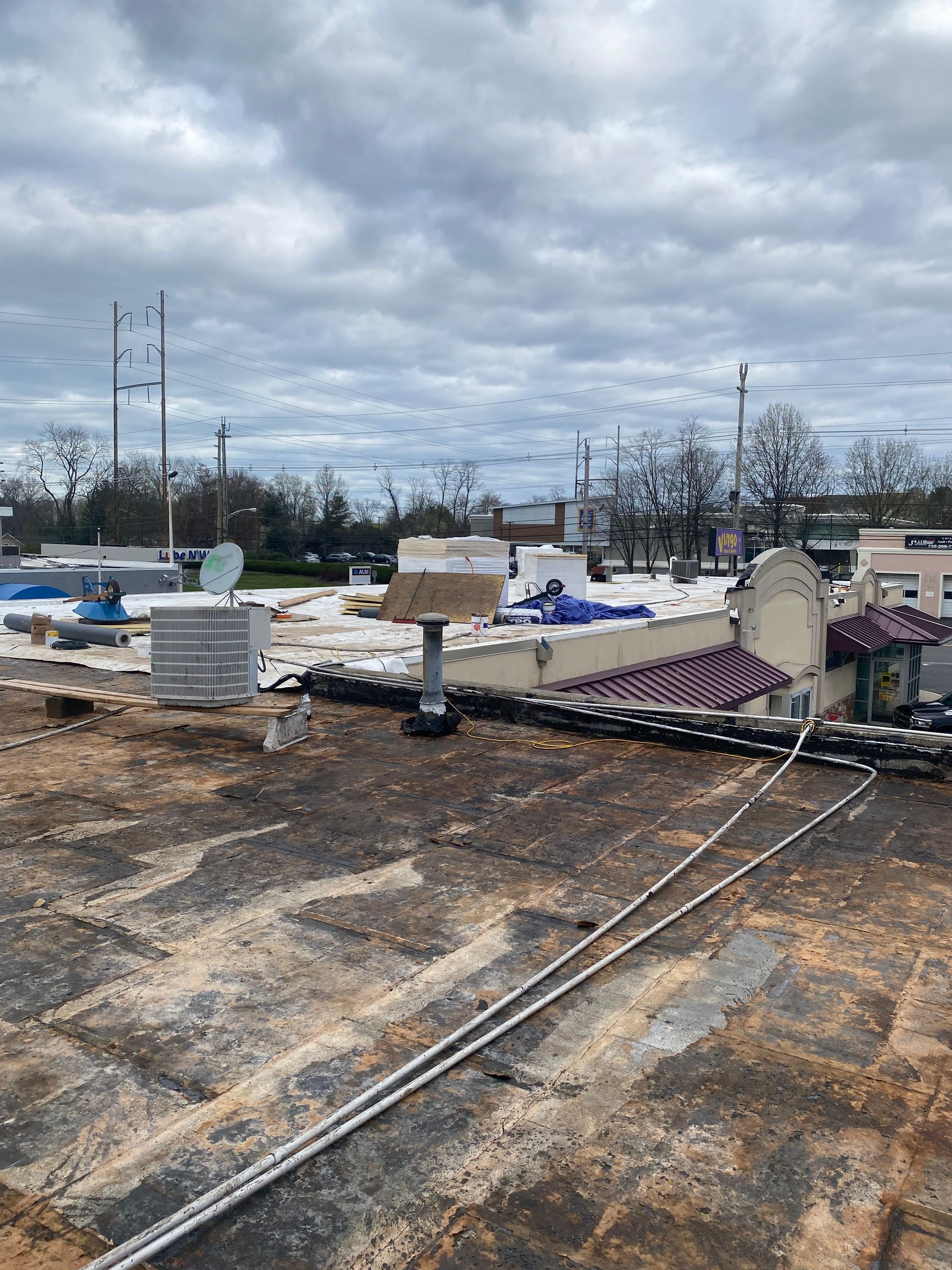 A roof of a building with a satellite dish on it.