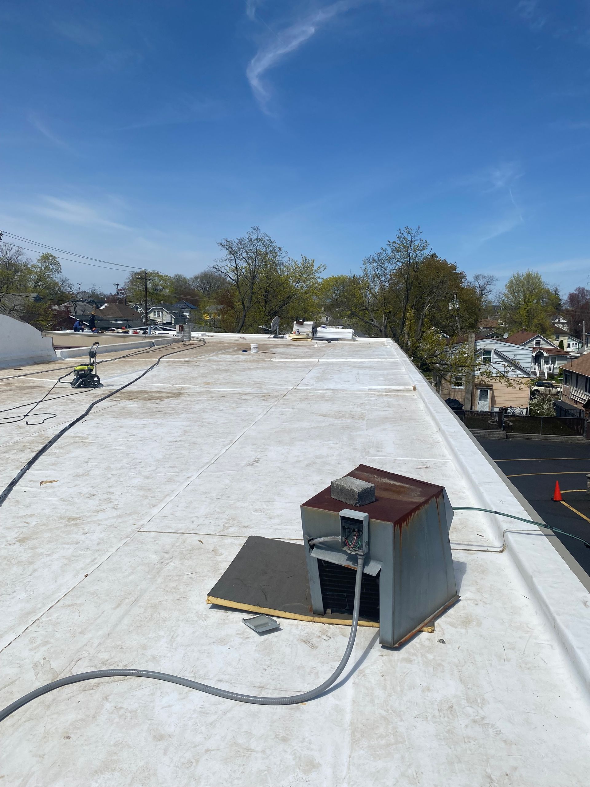 A white roof with a box on top of it.