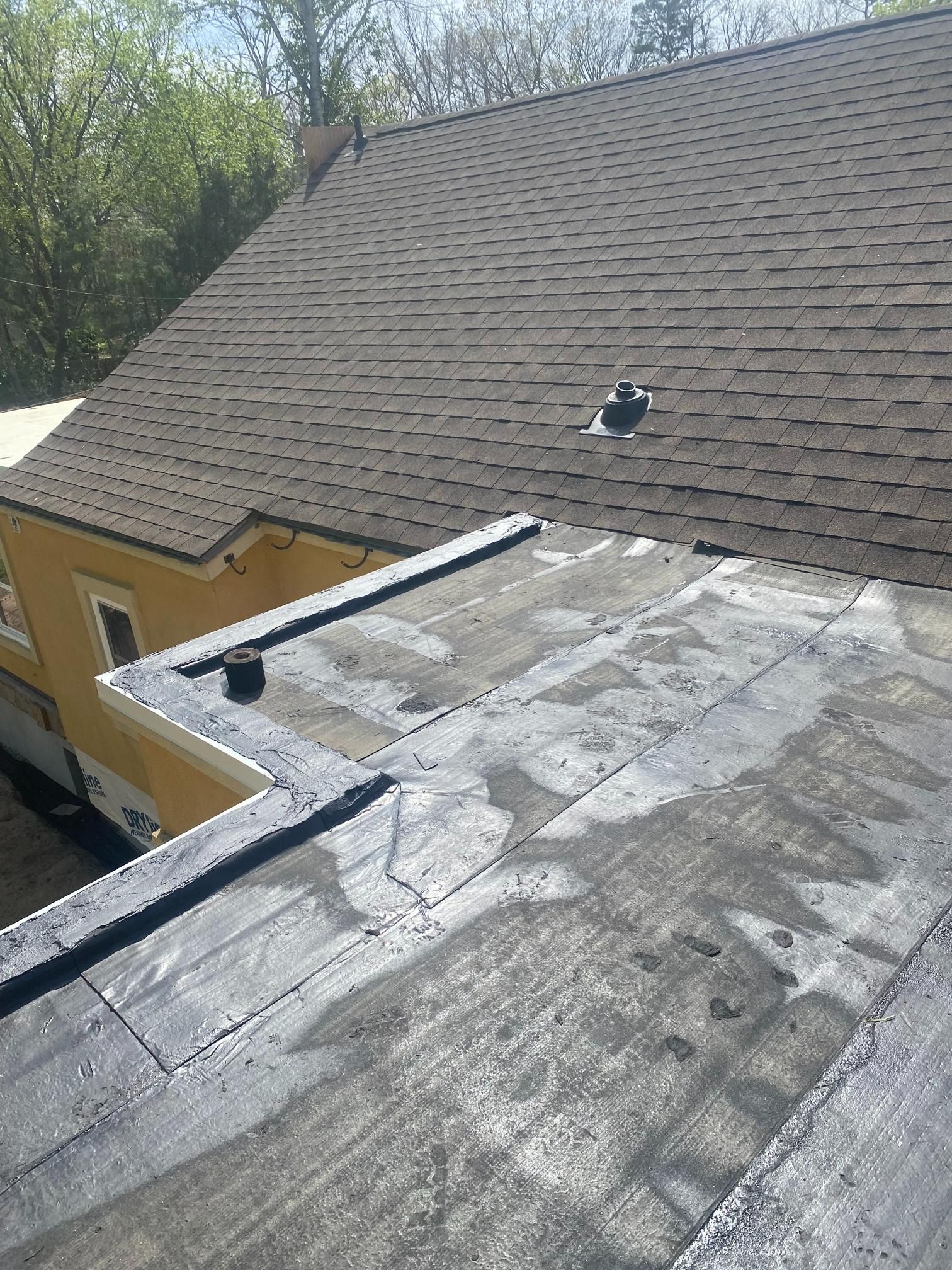 A close up of a roof of a house with a hole in it.