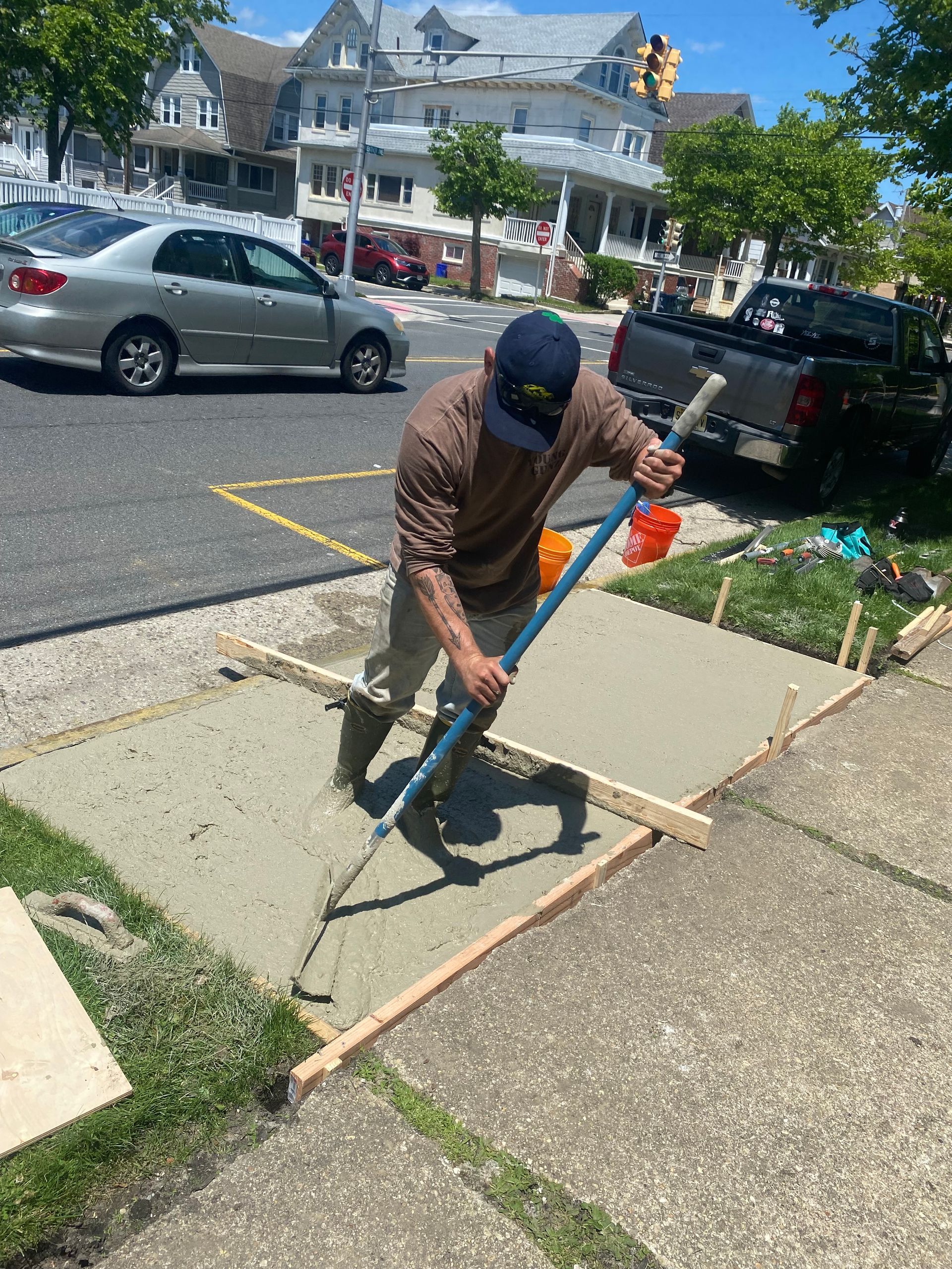 Two men are working on the roof of a house.