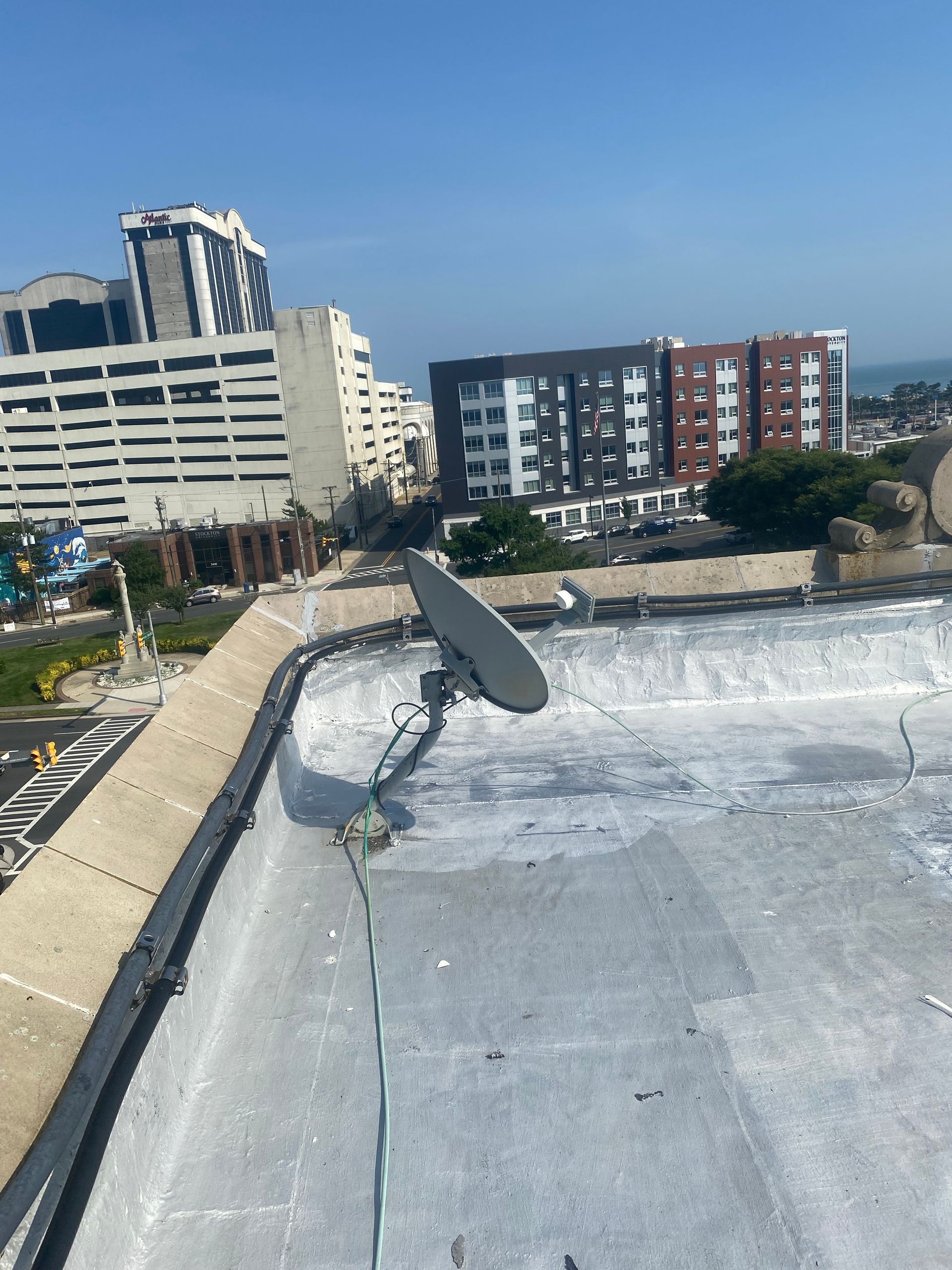 A satellite dish on the roof of a building