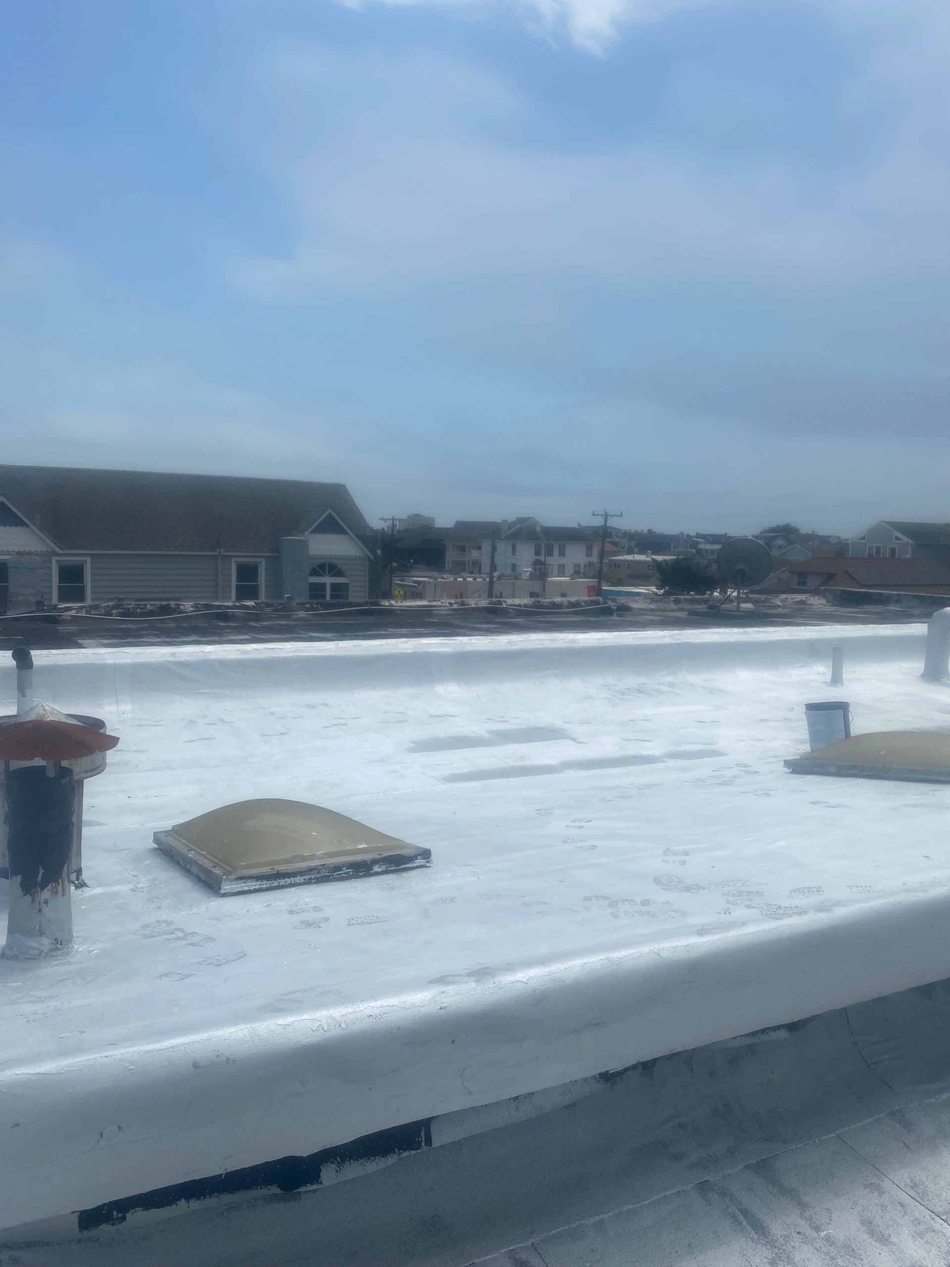 A white roof with a blue sky in the background.