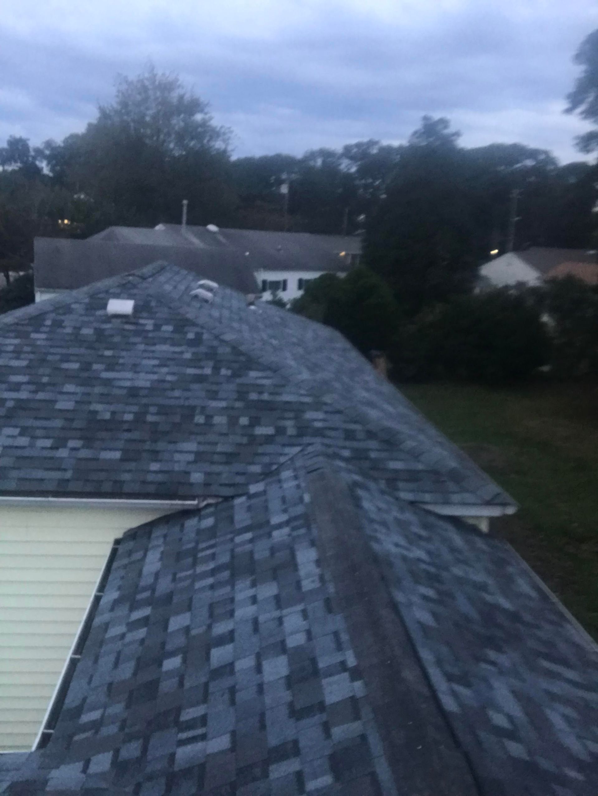 A house with a roof that has a lot of shingles on it