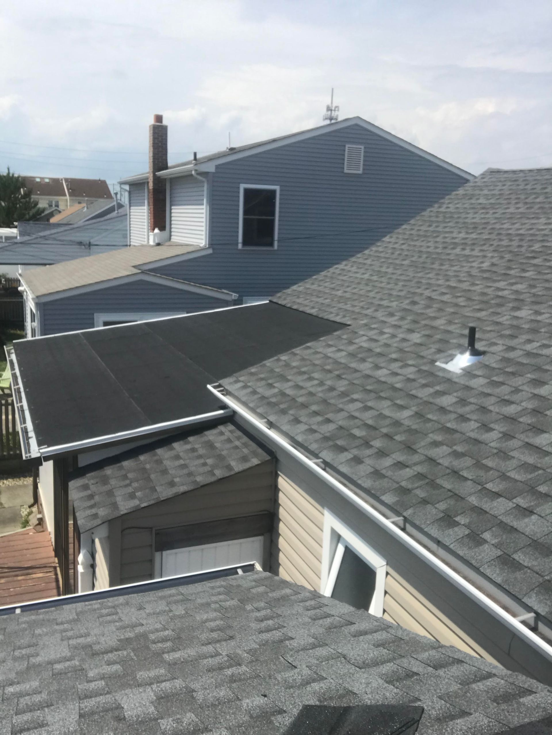 A house with a roof that has shingles on it