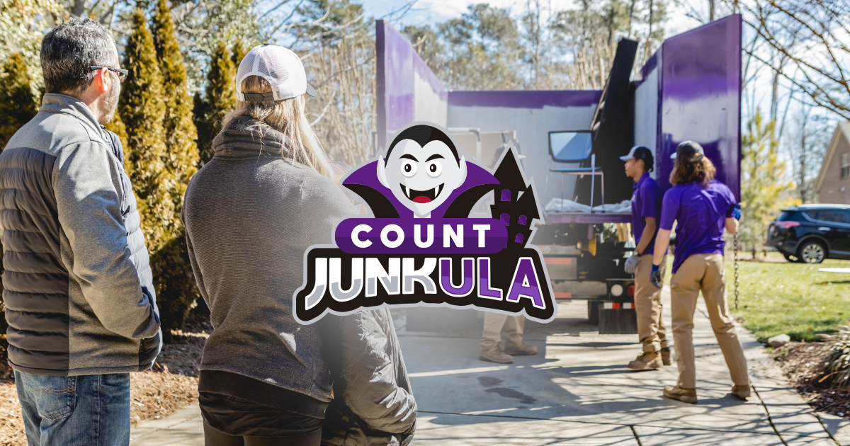 People entering a purple Count Junkula haunted house at an outdoor event