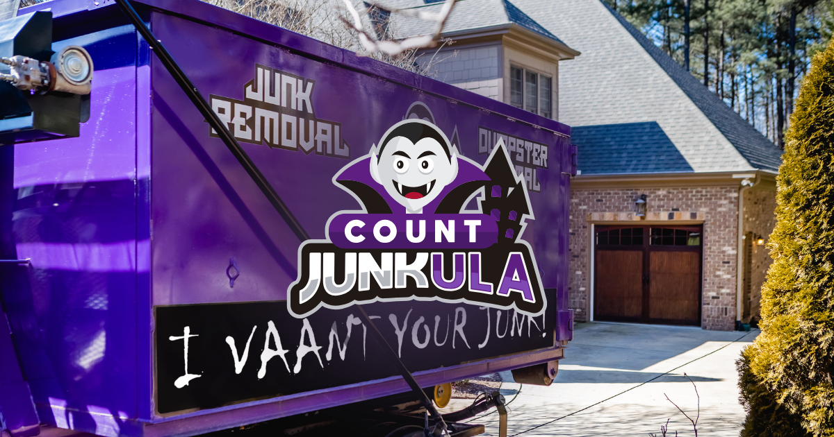 Purple parade float with a cartoon face and signs reading “COUNT JUNKULA” and “I WANT YOUR JUNK”