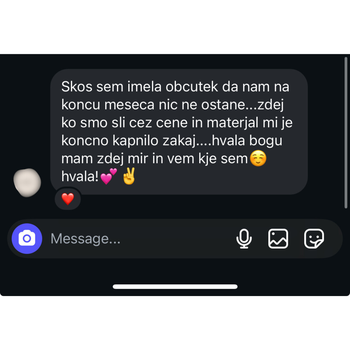 Screenshot of a text message expressing relief about understanding their finances, with a heart and peace sign emoji.