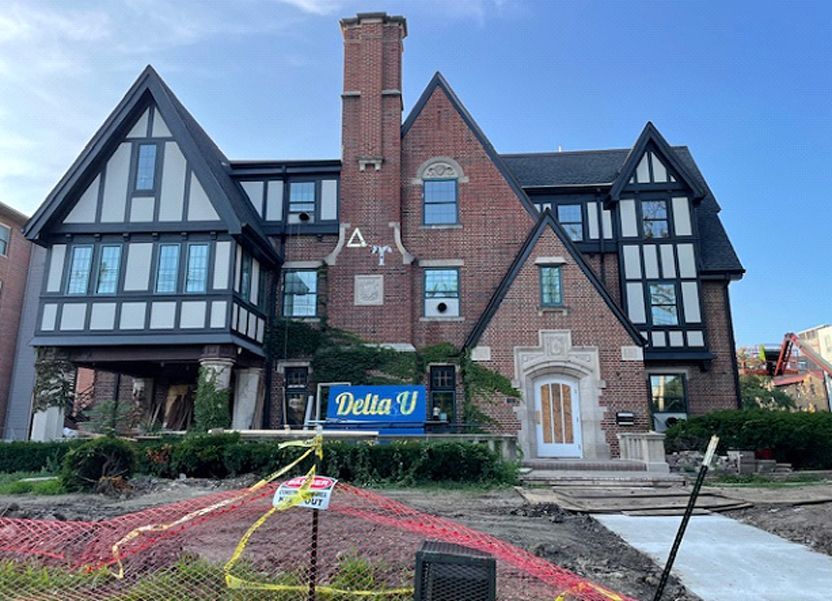 A large brick building with a sign that says delta u.