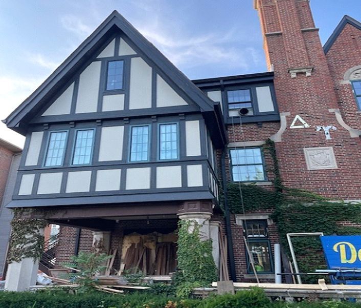 A large brick building with the letter a on it