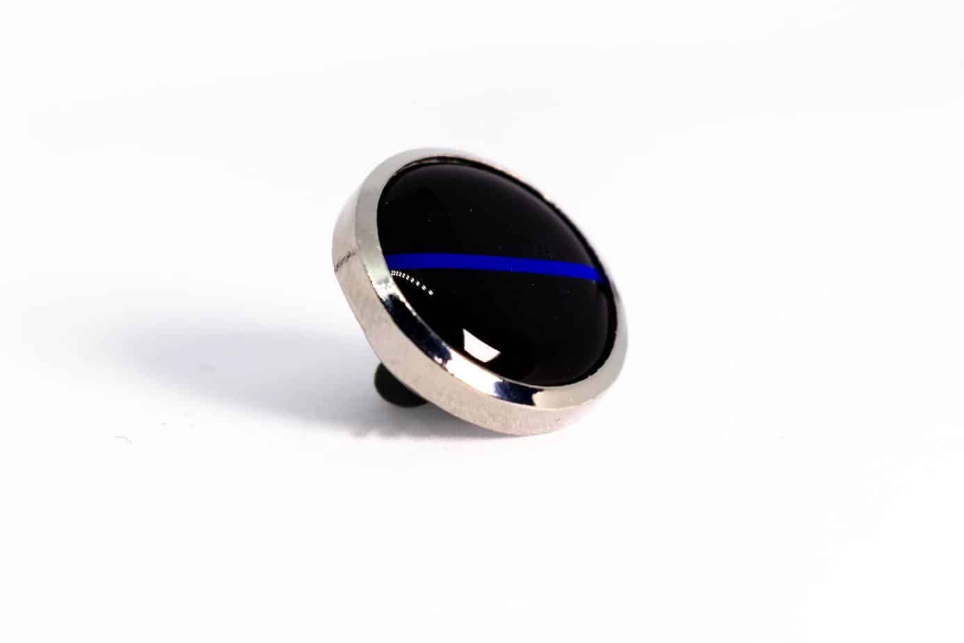 Pin with a black face, silver border, and blue line.
