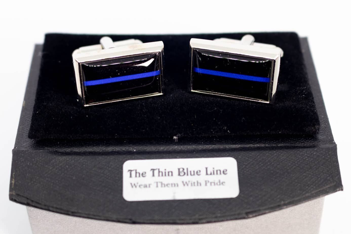 Thin blue line cufflinks in a display box.