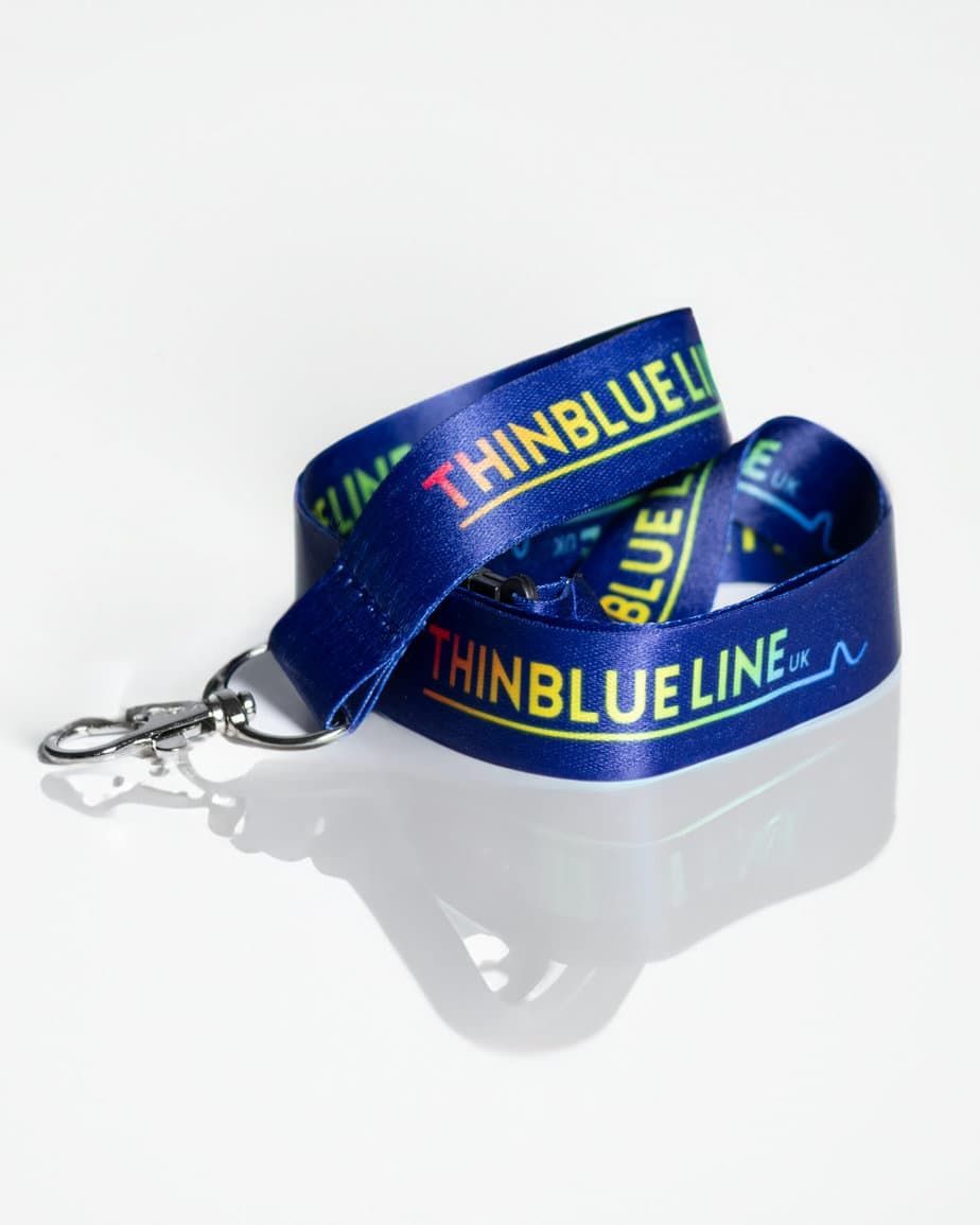 Blue lanyard with "THINBLUE LINE" text and silver clip, on white background.