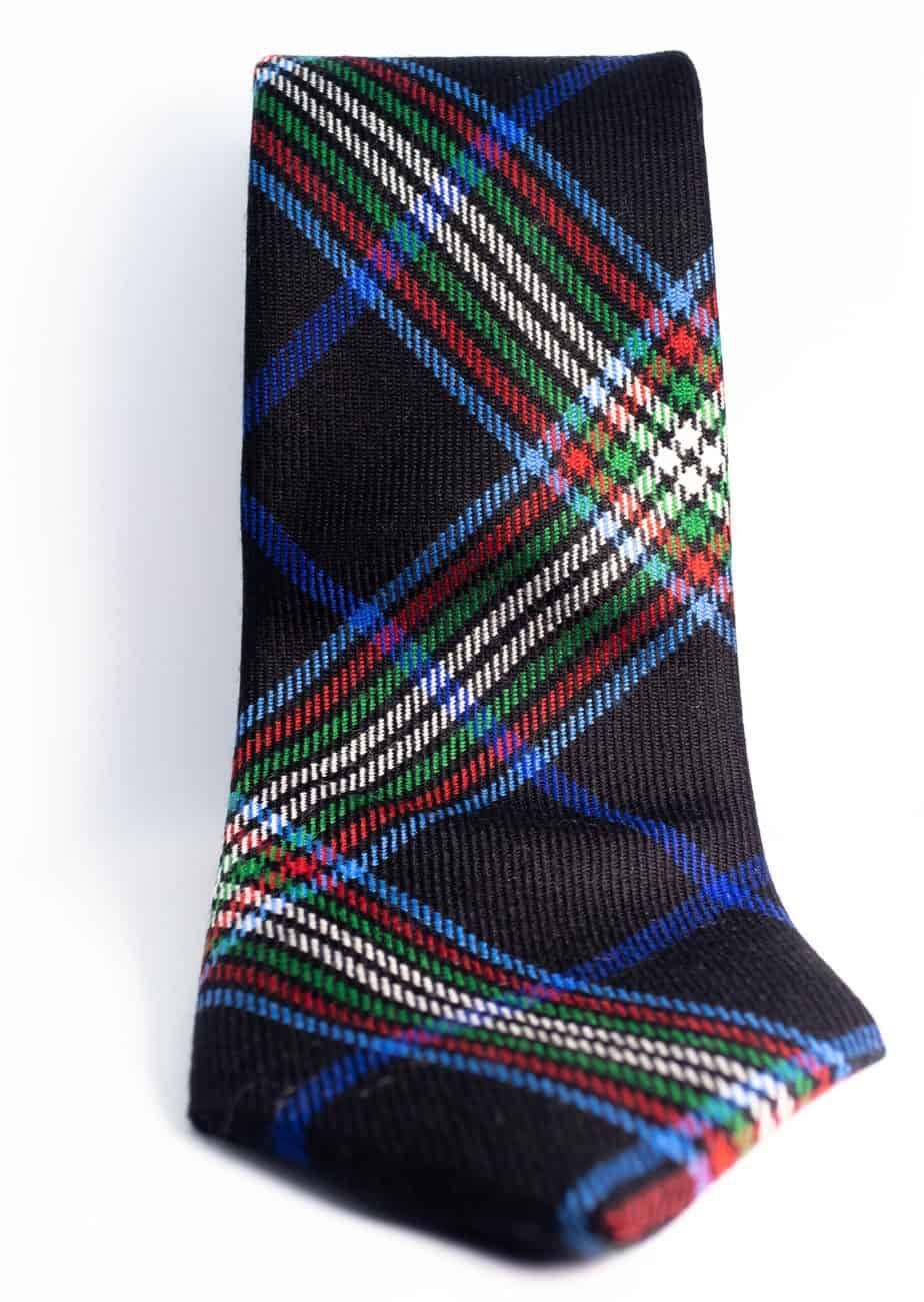 Black plaid necktie with blue, green, red, and white stripes.