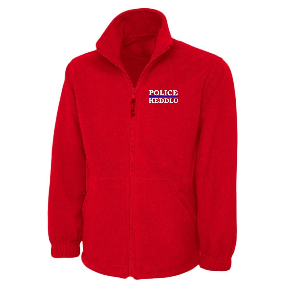 Red fleece jacket with "POLICE" over "IRELAND" in white lettering.