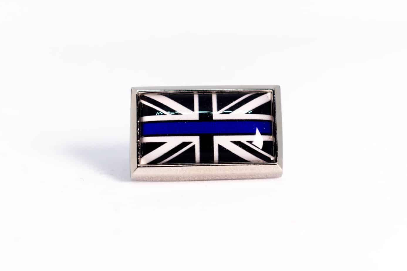 Square lapel pin with the Union Jack flag in black and white with a blue stripe.