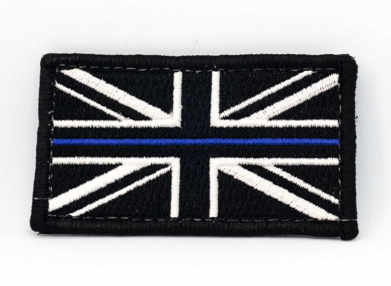 Black and white Union Jack flag with a blue line across the center, edged in black.