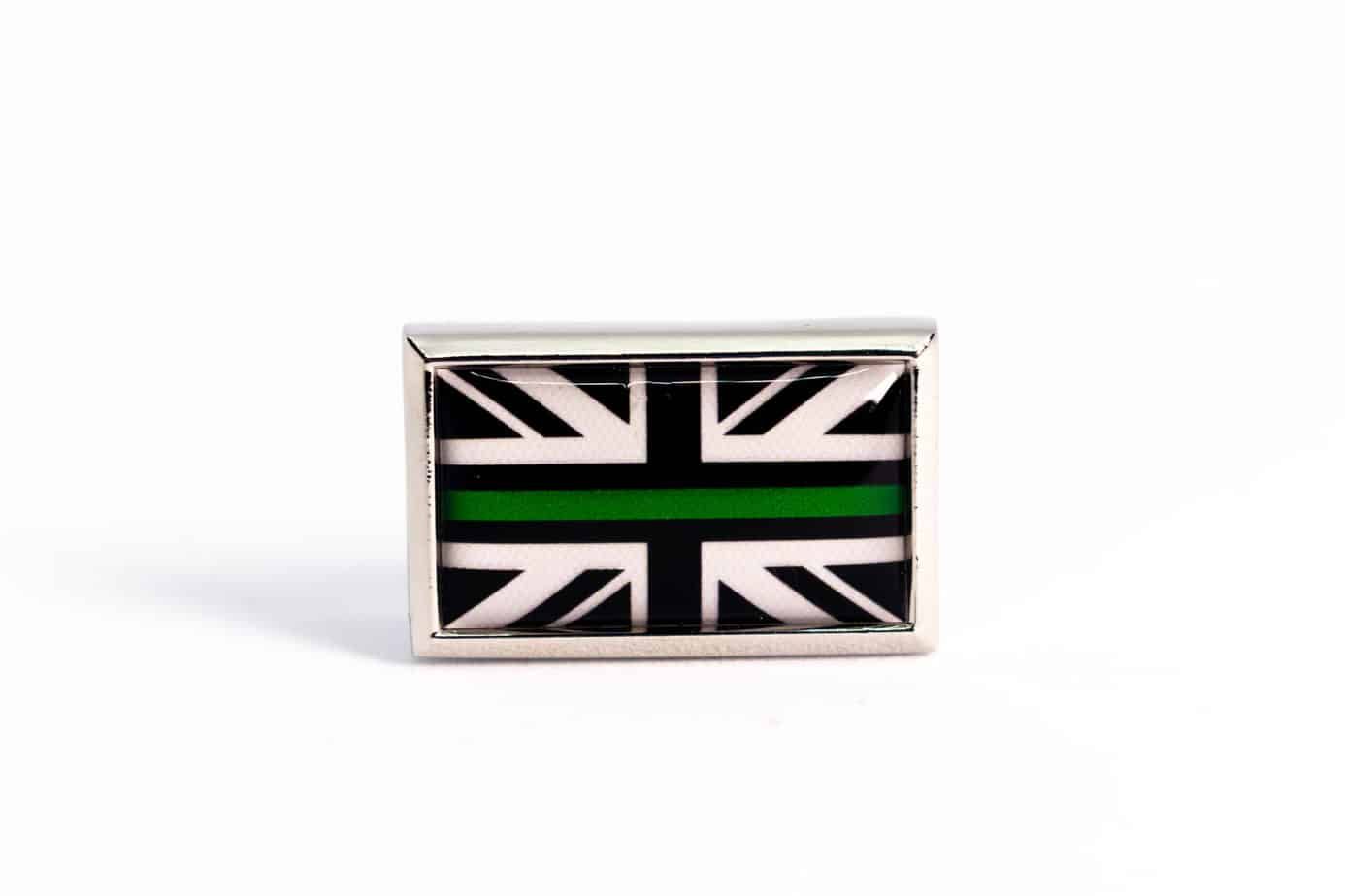 Lapel pin with a British flag design, featuring a green stripe.