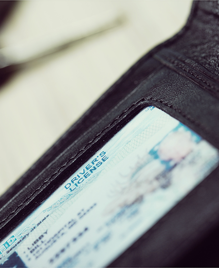 A close up of a driver 's license in a wallet