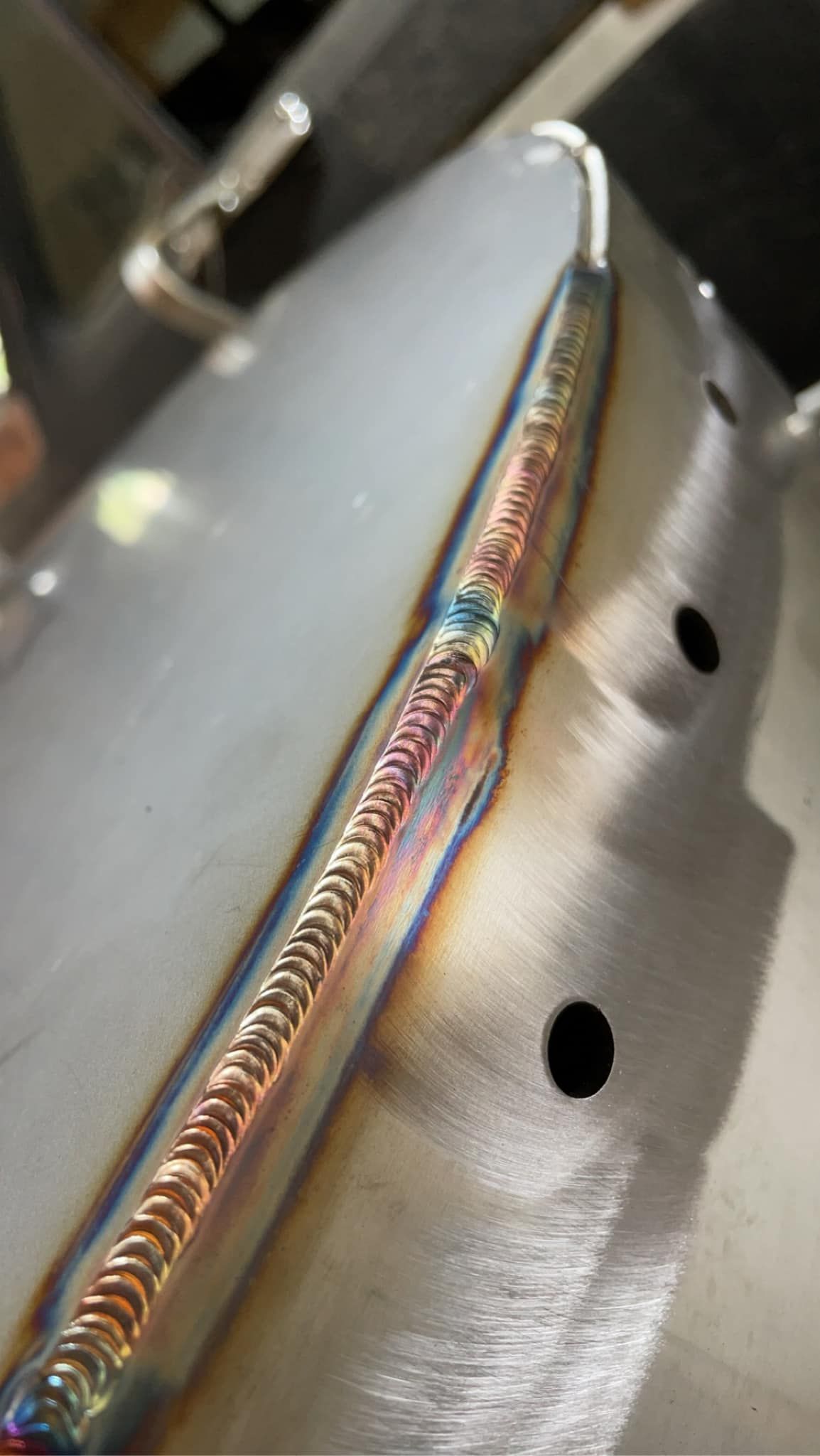 A close up of a welding joint on a piece of metal.