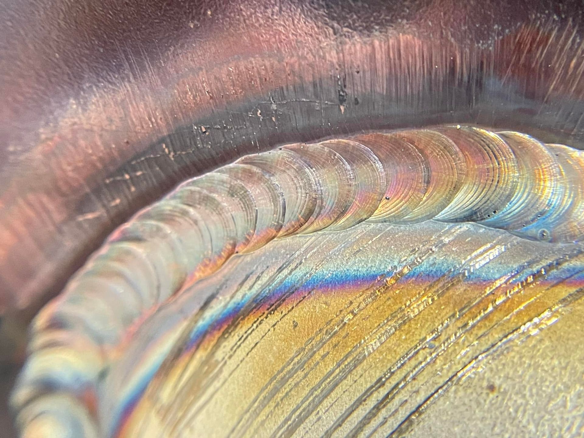 A close up of a welding weld on a piece of metal.